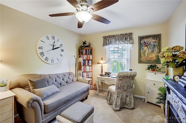 office featuring ceiling fan and light colored carpet