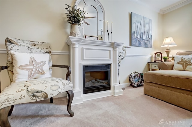 living area with light colored carpet and ornamental molding