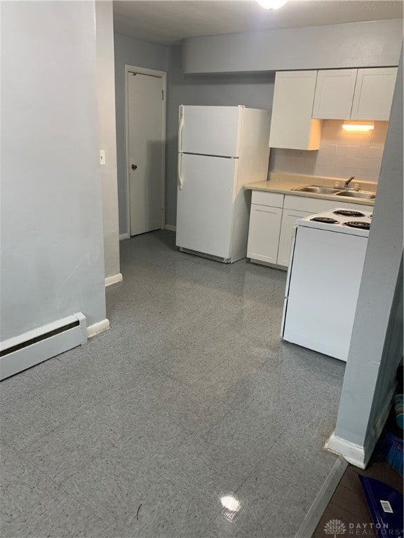 kitchen featuring white cabinets, sink, white appliances, tasteful backsplash, and a baseboard heating unit