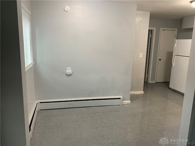 spare room with baseboard heating