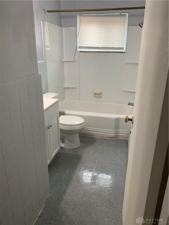 full bathroom featuring tub / shower combination, vanity, and toilet