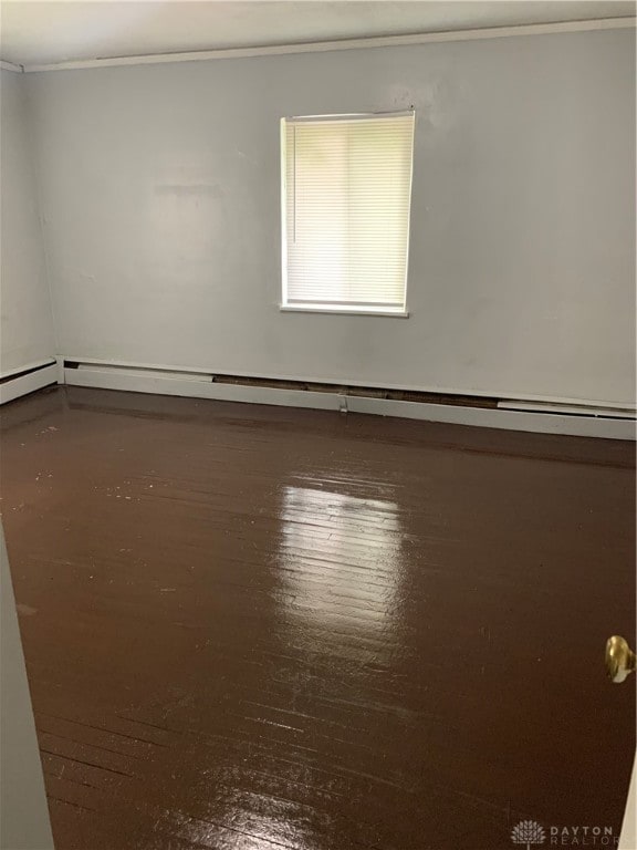 spare room with wood-type flooring