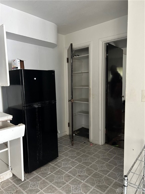 kitchen with black fridge