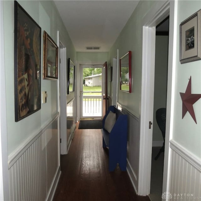 corridor featuring dark wood-type flooring