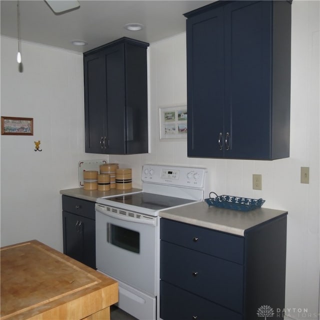 kitchen with blue cabinets and white electric range