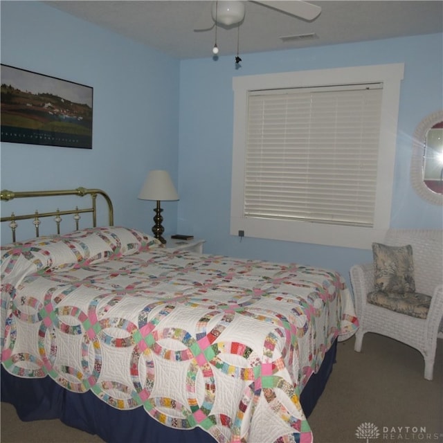 bedroom featuring ceiling fan and carpet flooring