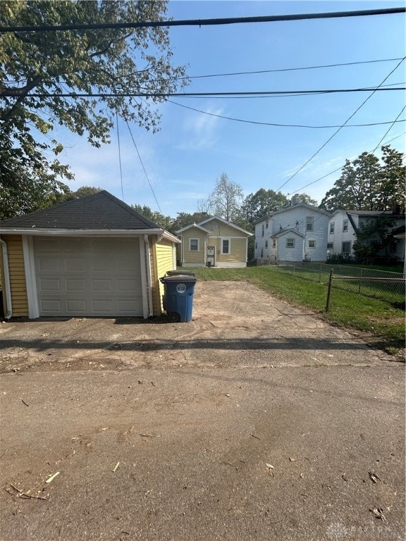 view of front of home featuring a garage and an outdoor structure