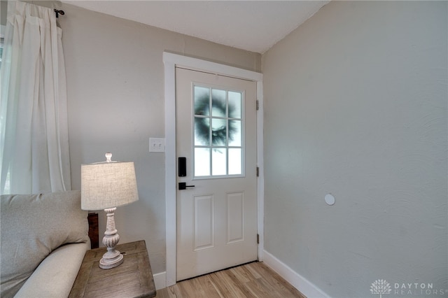 doorway with light wood-type flooring