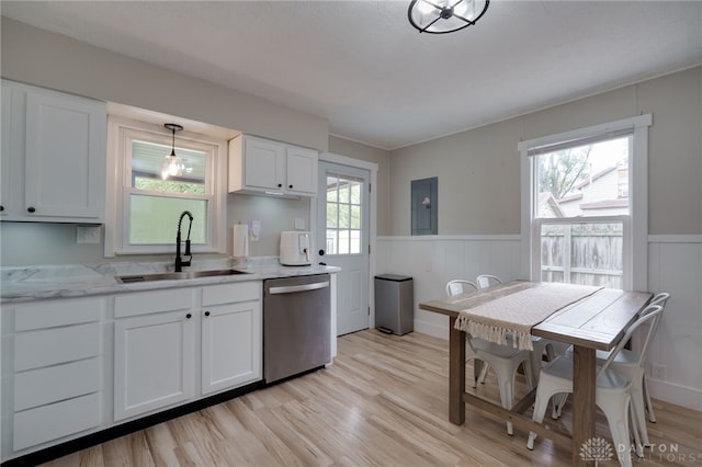 kitchen with white cabinetry, stainless steel dishwasher, decorative light fixtures, and sink