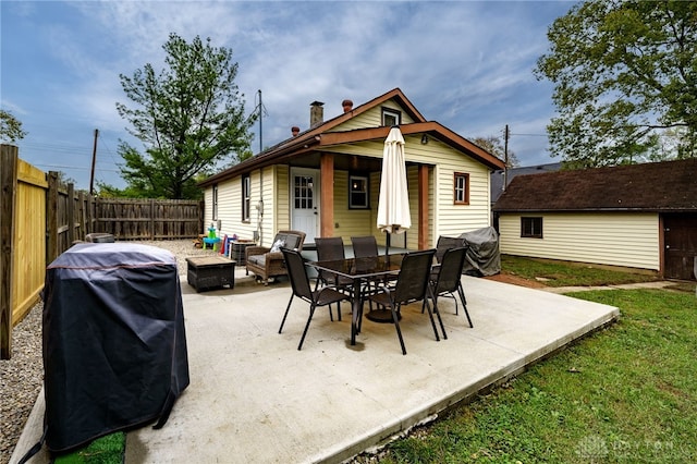 view of patio / terrace featuring area for grilling and an outdoor fire pit