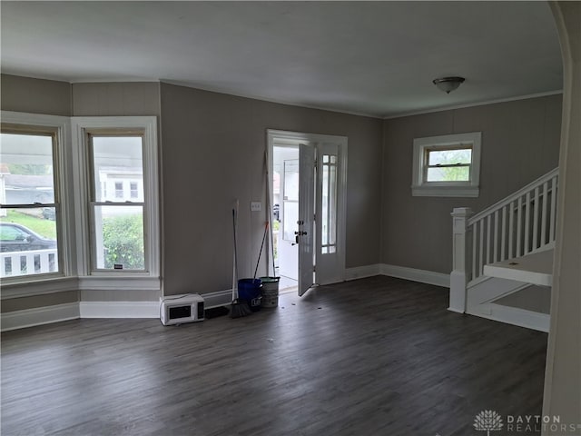 entryway featuring crown molding and dark hardwood / wood-style flooring