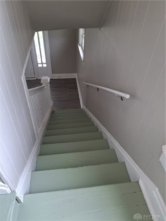 stairway featuring hardwood / wood-style flooring