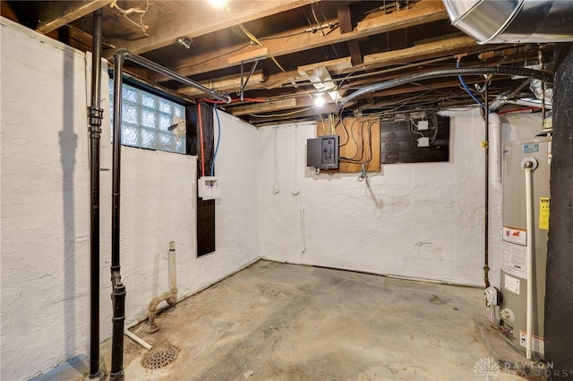 basement featuring water heater and electric panel