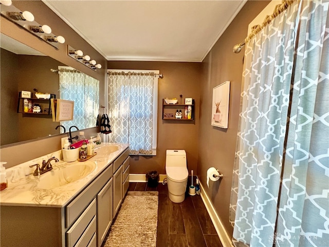 bathroom featuring vanity, crown molding, toilet, and hardwood / wood-style flooring