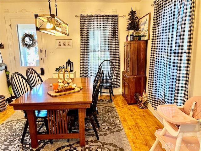 dining space with light wood-type flooring