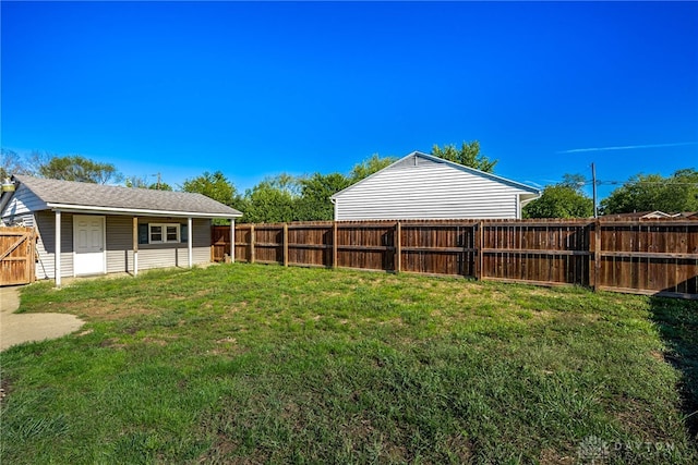 view of yard with a fenced backyard