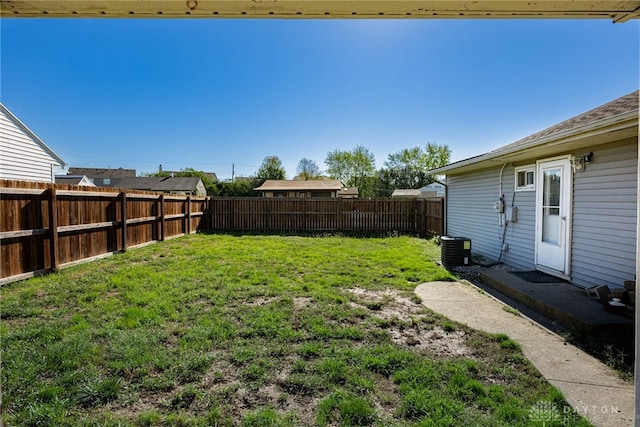 view of yard with a fenced backyard