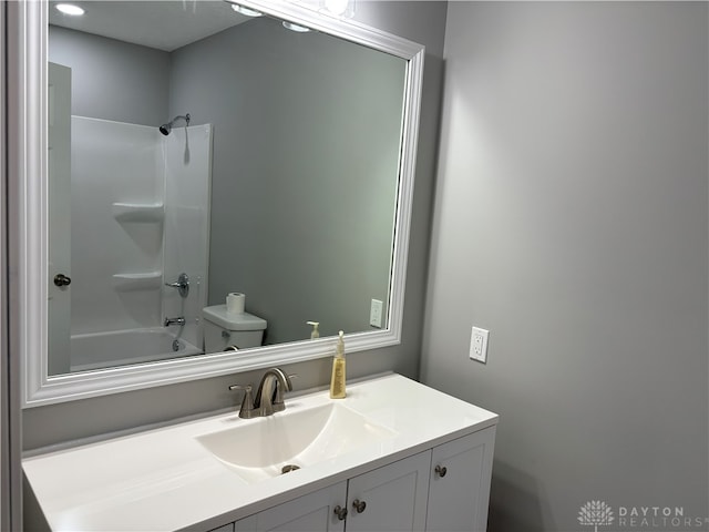 full bathroom with shower / bathtub combination, vanity, and toilet