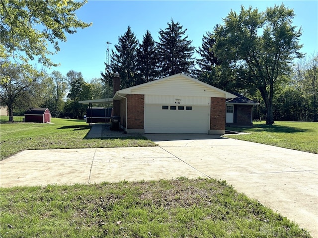 garage featuring a lawn