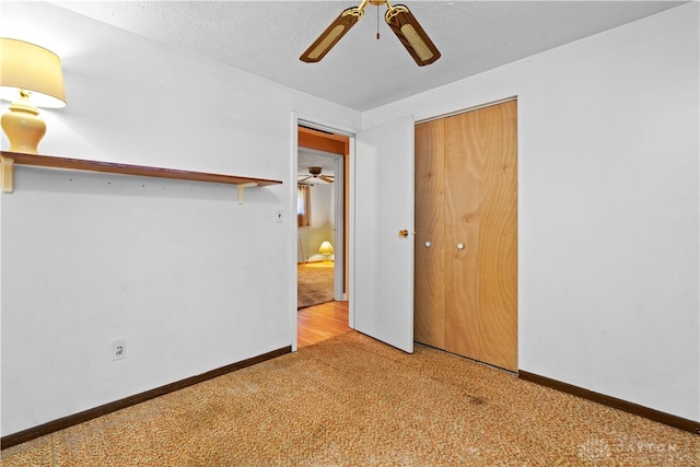 carpeted empty room featuring a textured ceiling