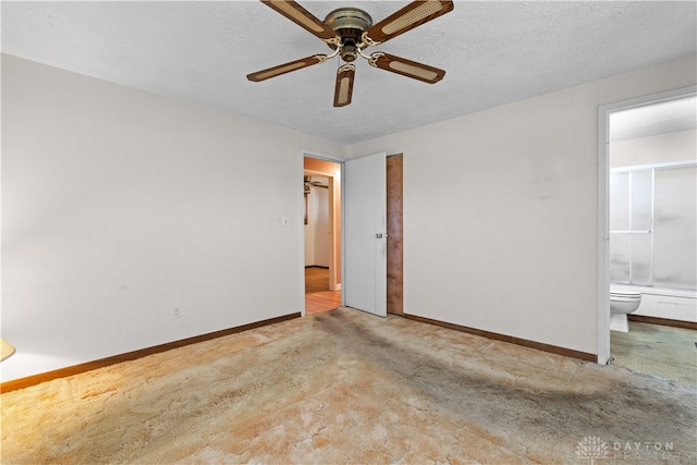 spare room with light carpet, ceiling fan, and a textured ceiling