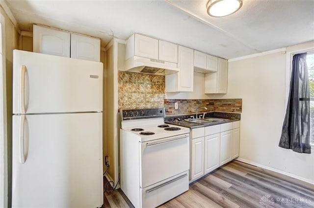 kitchen featuring decorative backsplash, white appliances, sink, and light hardwood / wood-style flooring