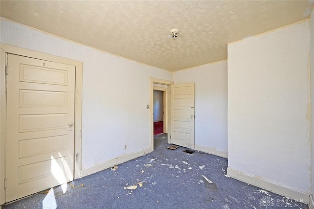 empty room with a textured ceiling