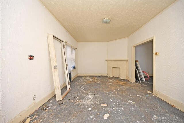 empty room featuring a textured ceiling