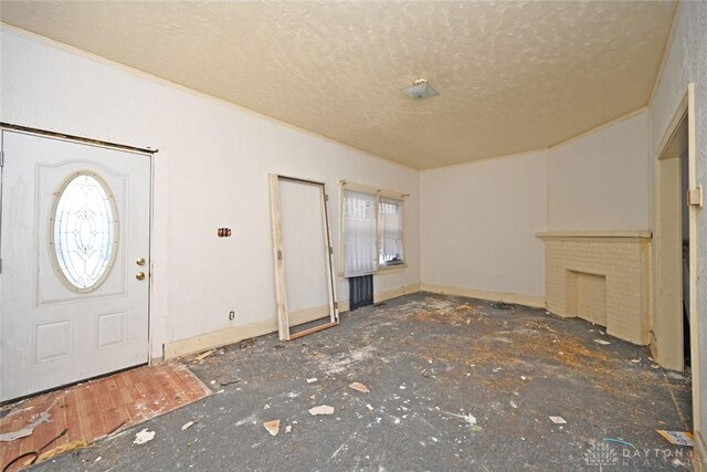 entryway with a textured ceiling