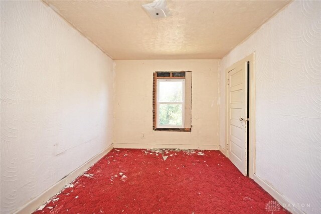 empty room with carpet flooring