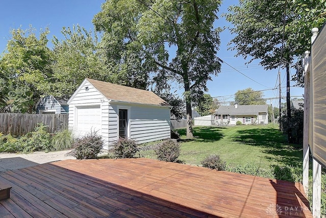 wooden terrace featuring an outbuilding and a yard