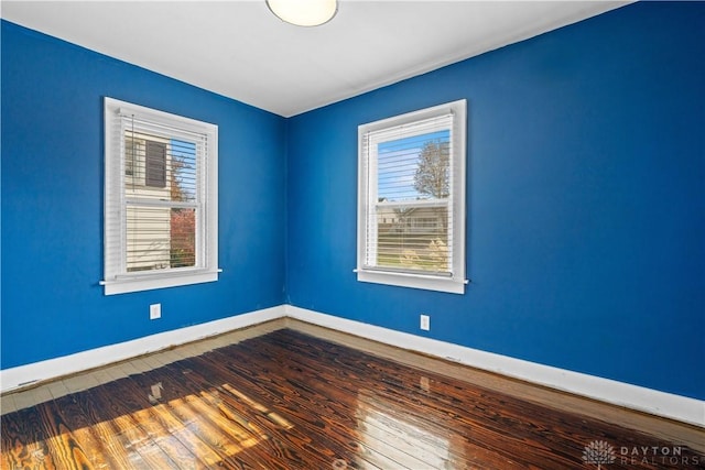 spare room featuring hardwood / wood-style floors