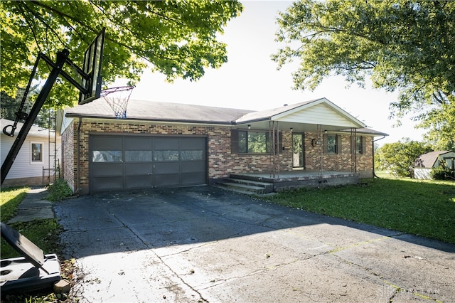 single story home with a front yard and a garage