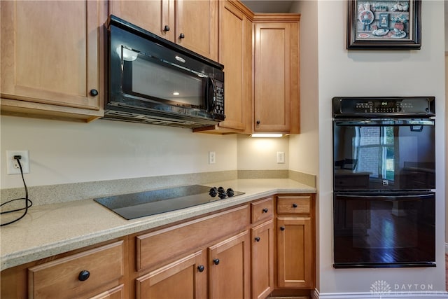 kitchen featuring black appliances