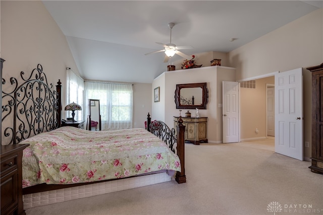 bedroom with lofted ceiling, light colored carpet, and ceiling fan