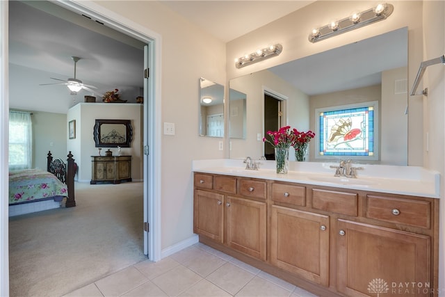 bathroom featuring ceiling fan, tile patterned flooring, and vanity