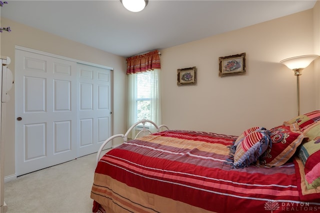 bedroom with a closet and carpet flooring