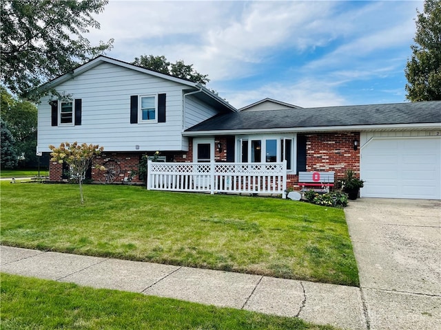 split level home with a garage, covered porch, and a front yard