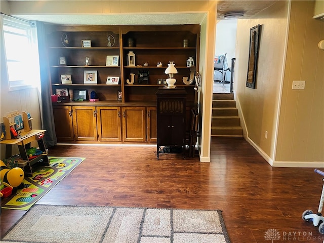 bar featuring dark hardwood / wood-style flooring