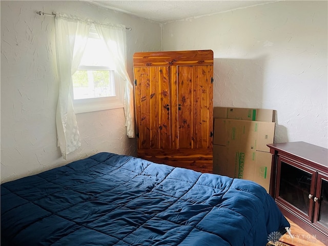 bedroom featuring a textured ceiling