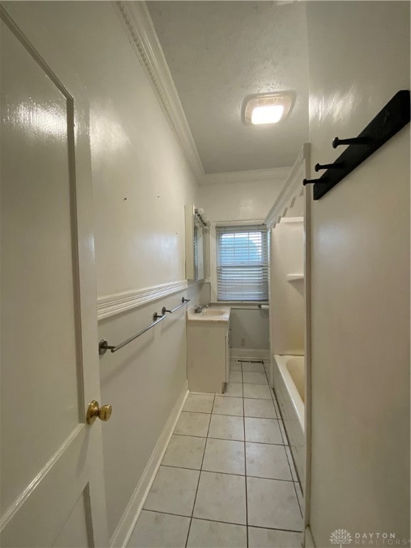 bathroom featuring independent shower and bath, vanity, tile patterned flooring, and ornamental molding