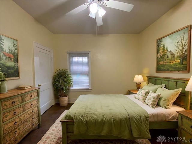 bedroom featuring ceiling fan and dark hardwood / wood-style floors