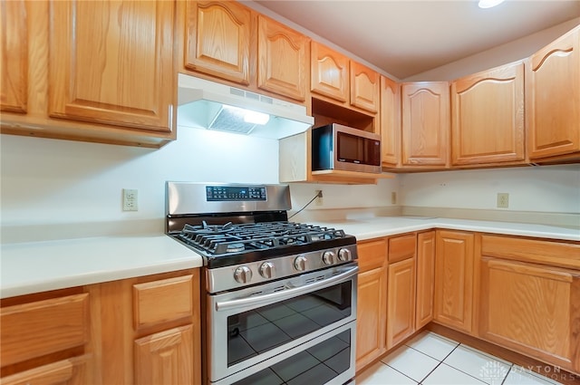 kitchen with stainless steel appliances and light tile patterned floors