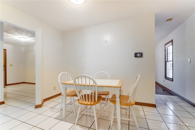 dining room with light tile patterned flooring