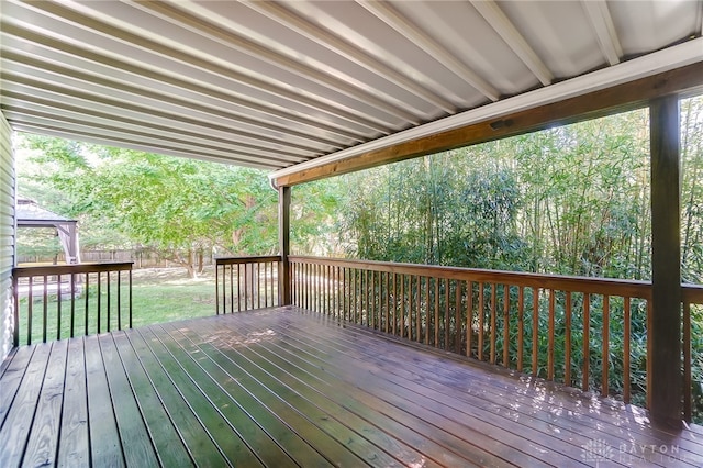 wooden deck with a lawn