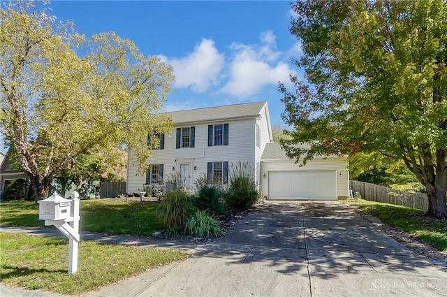 view of front of property featuring a garage and a front yard