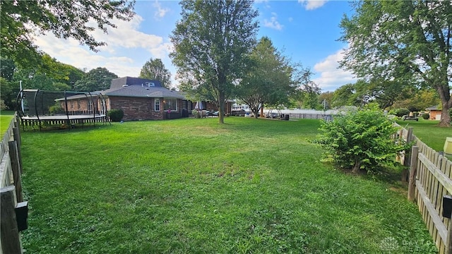 view of yard featuring a trampoline