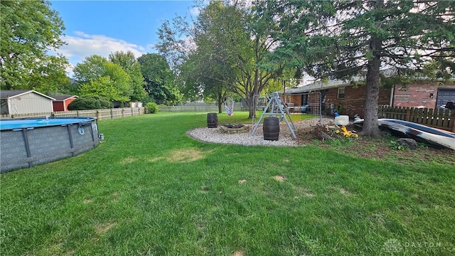 view of yard featuring a fenced in pool