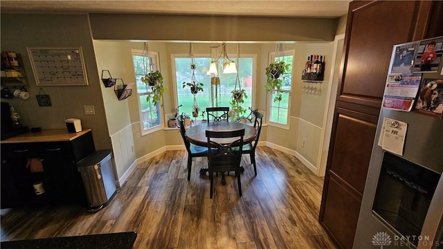 dining area featuring dark hardwood / wood-style floors