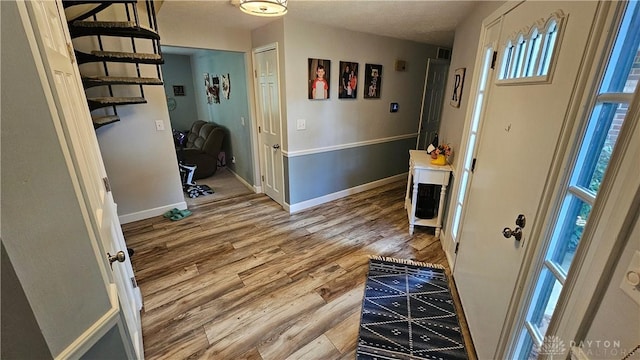 entrance foyer with hardwood / wood-style flooring